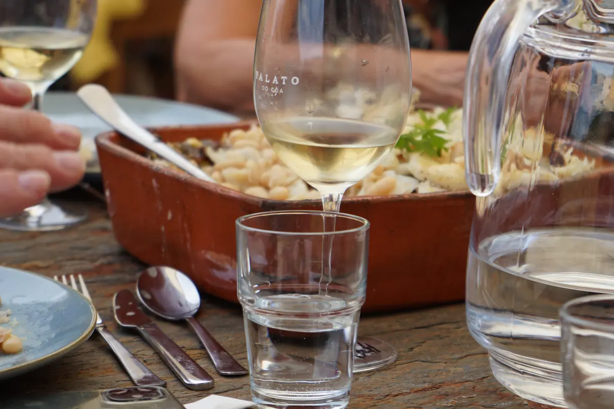 Palato white wine served with food at the stone table